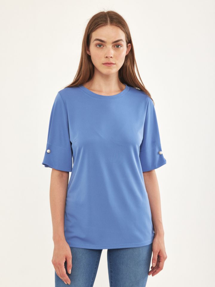 חולצה שרוול פנינים בצבע תכלת