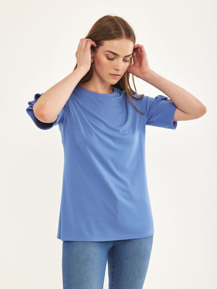 חולצה שרוול פנינים בצבע תכלת