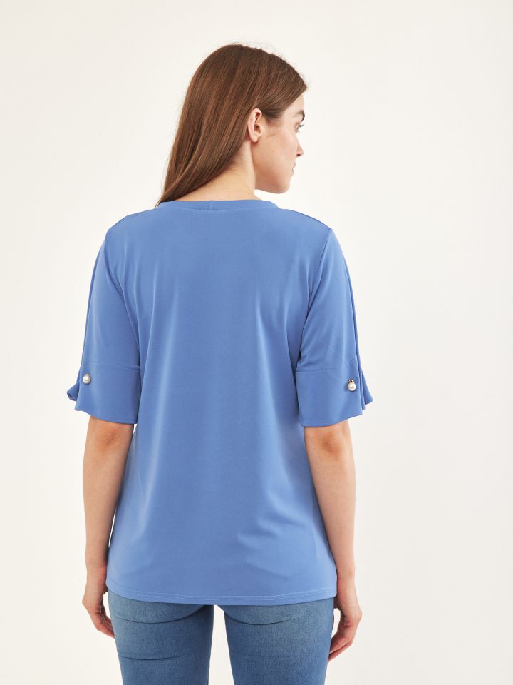 חולצה שרוול פנינים בצבע תכלת