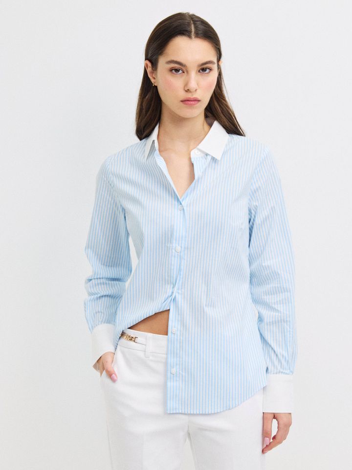 חולצה פסים שילוב מנגטים בצבע תכלת