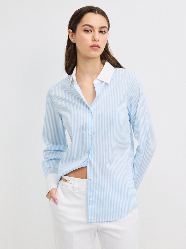 חולצה פסים שילוב מנגטים בצבע תכלת