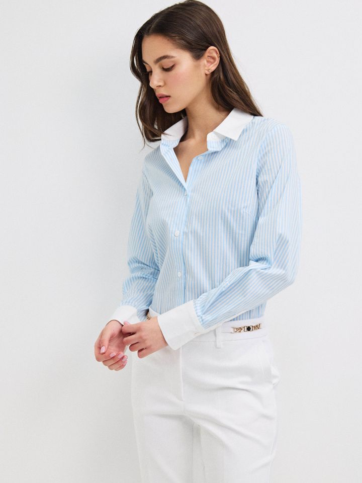 חולצה פסים שילוב מנגטים בצבע תכלת