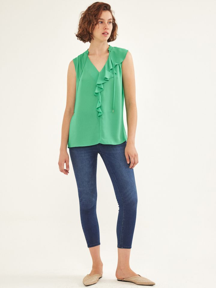 חולצה מלמלה בצבע ירוק בהיר