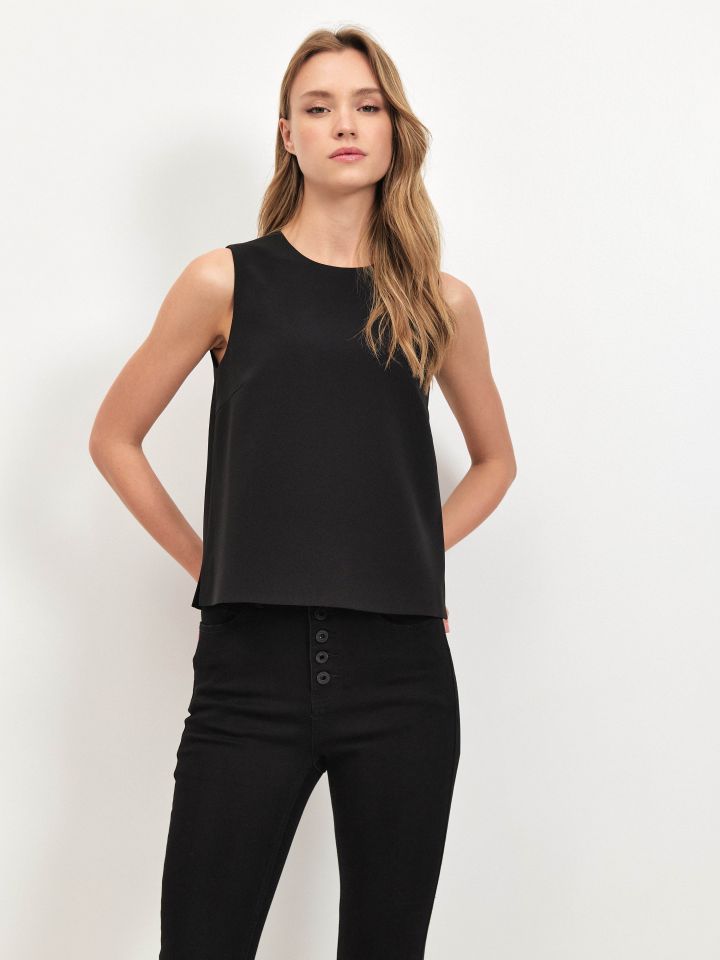 חולצה NATALY רוכסן בגב בצבע שחור