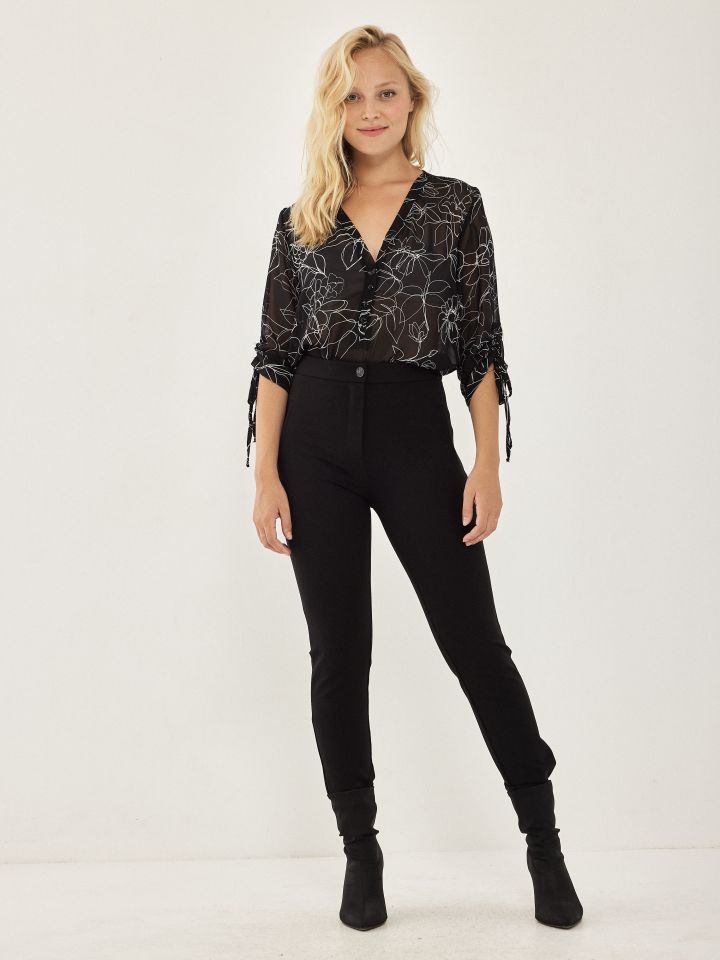 מכנסי כיתוב בלבן PROMO בצבע שחור