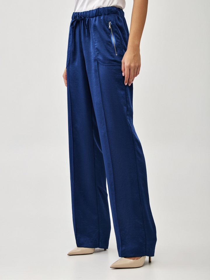 מכנסיים סטן כיסים בצבע כחול