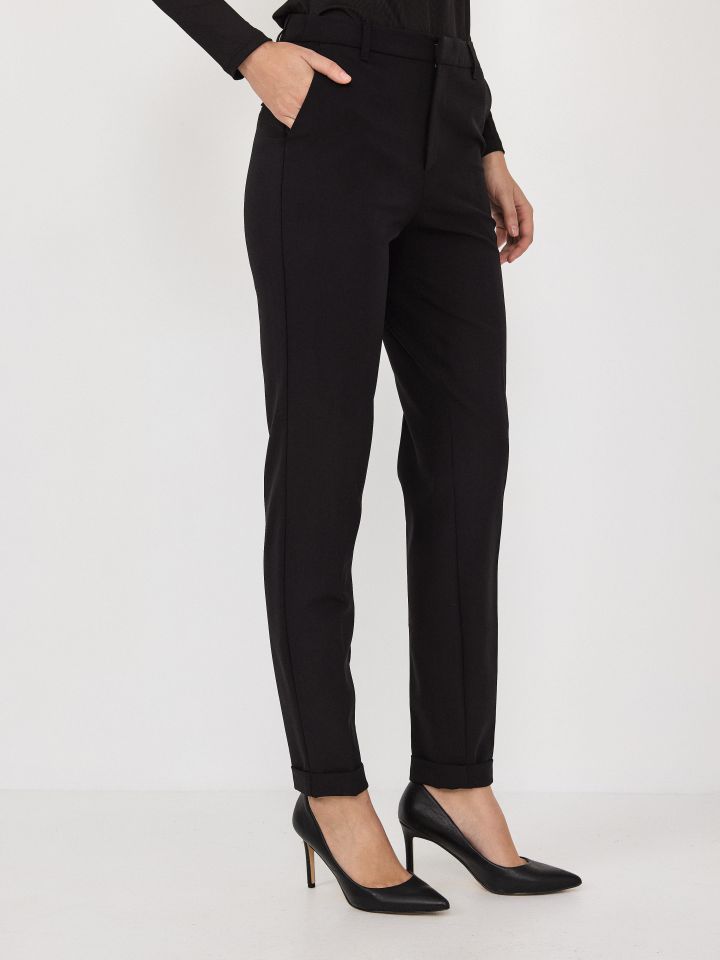 מכנסיים כיסי צד + מנג’ט בצבע שחור