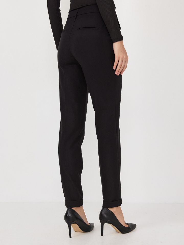 מכנסיים כיסי צד + מנג’ט בצבע שחור