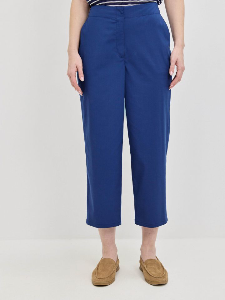 מכנסיים כיסי צד 8/9 בצבע כחול אינדיגו