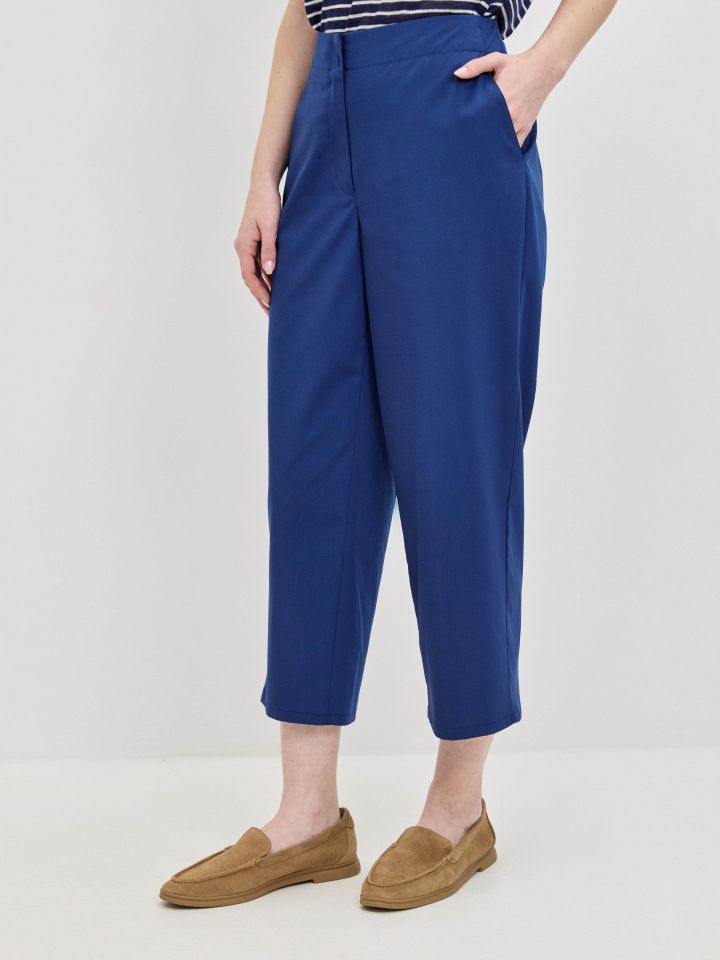 מכנסיים כיסי צד 8/9 בצבע כחול אינדיגו