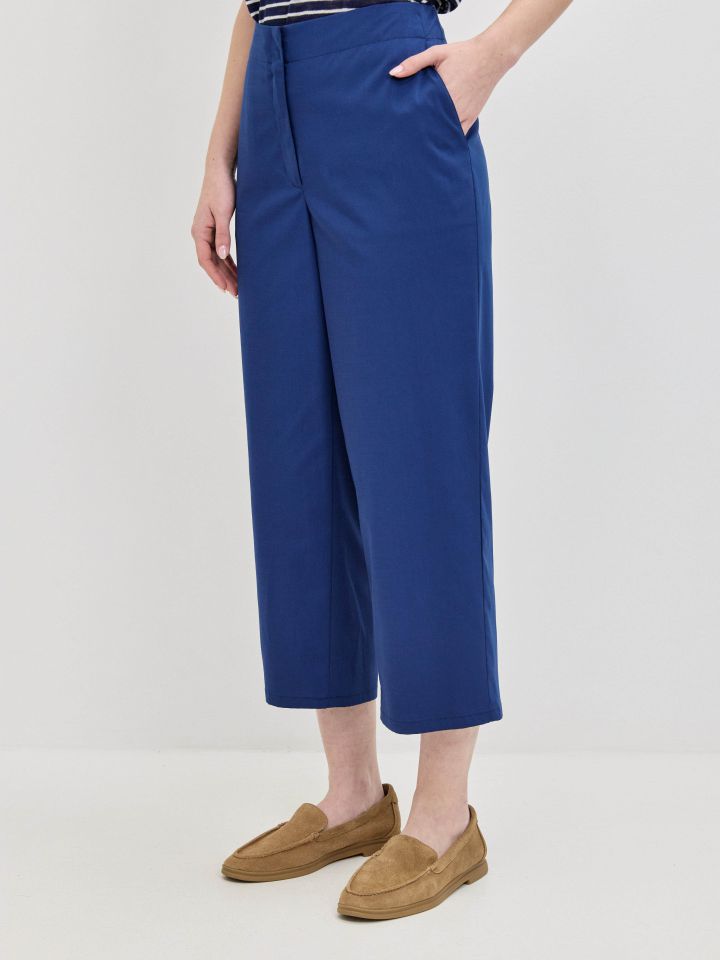 מכנסיים כיסי צד 8/9 בצבע כחול אינדיגו