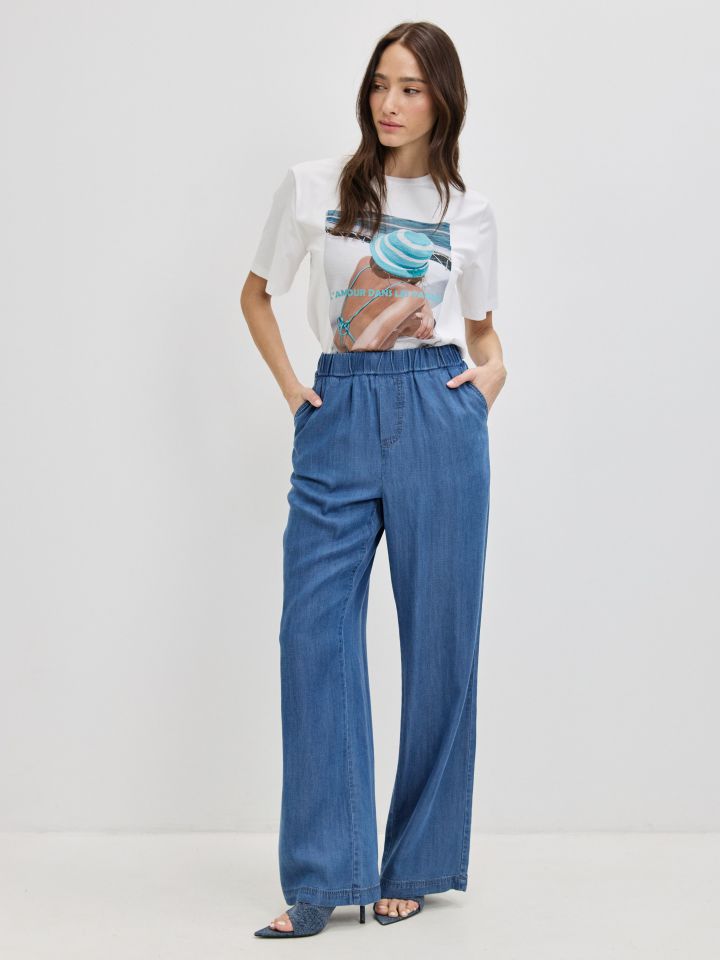 מכנסיים ג’ינס גומי בצבע ג’ינס