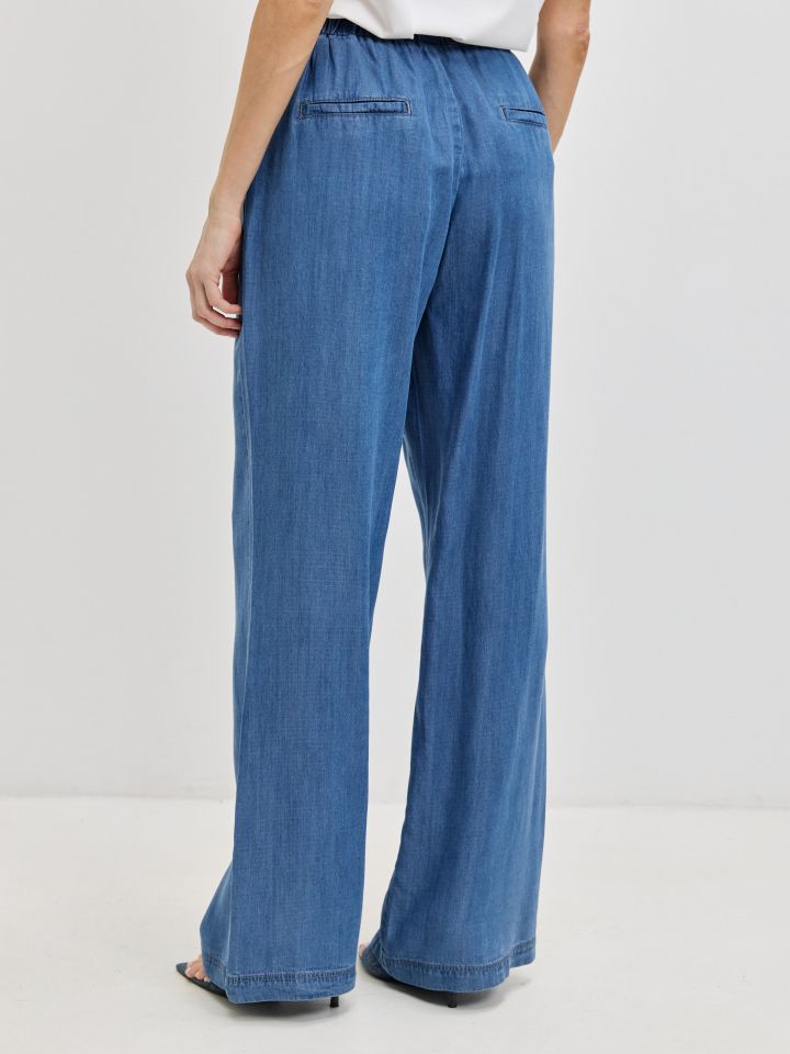 מכנסיים ג’ינס גומי בצבע ג’ינס