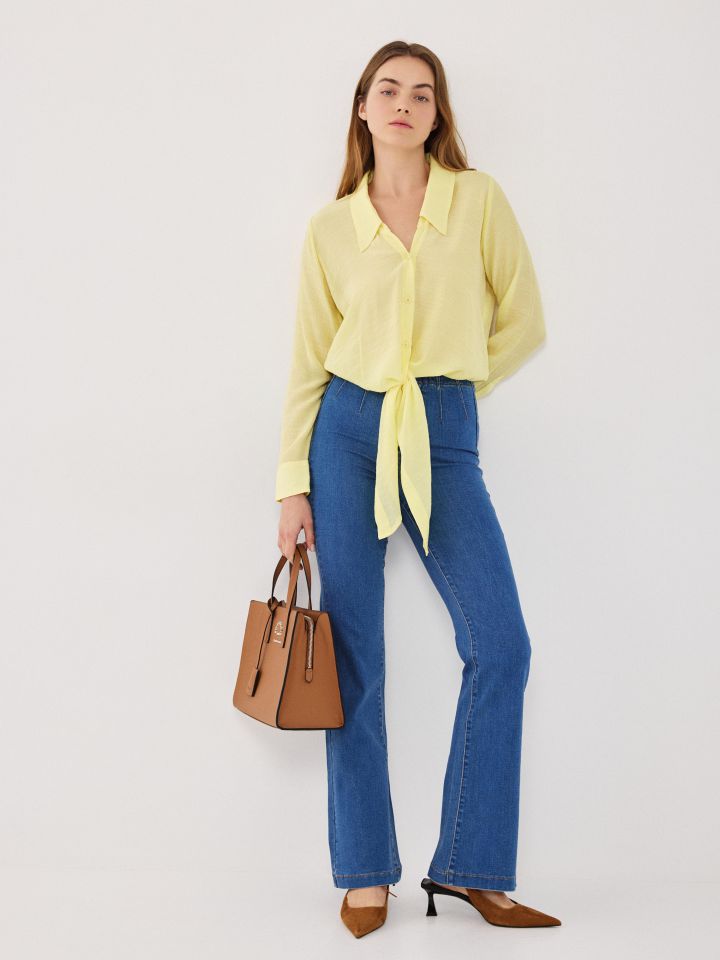 מכנסיים ג’ינס מתרחב בצבע ג’ינס