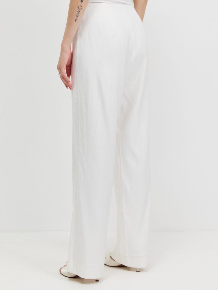 מכנסיים פסי פייטים בצבע אופוויט