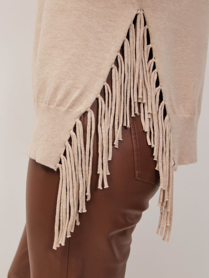 סריג גולף פרנזים בצבע בייז מלנג’