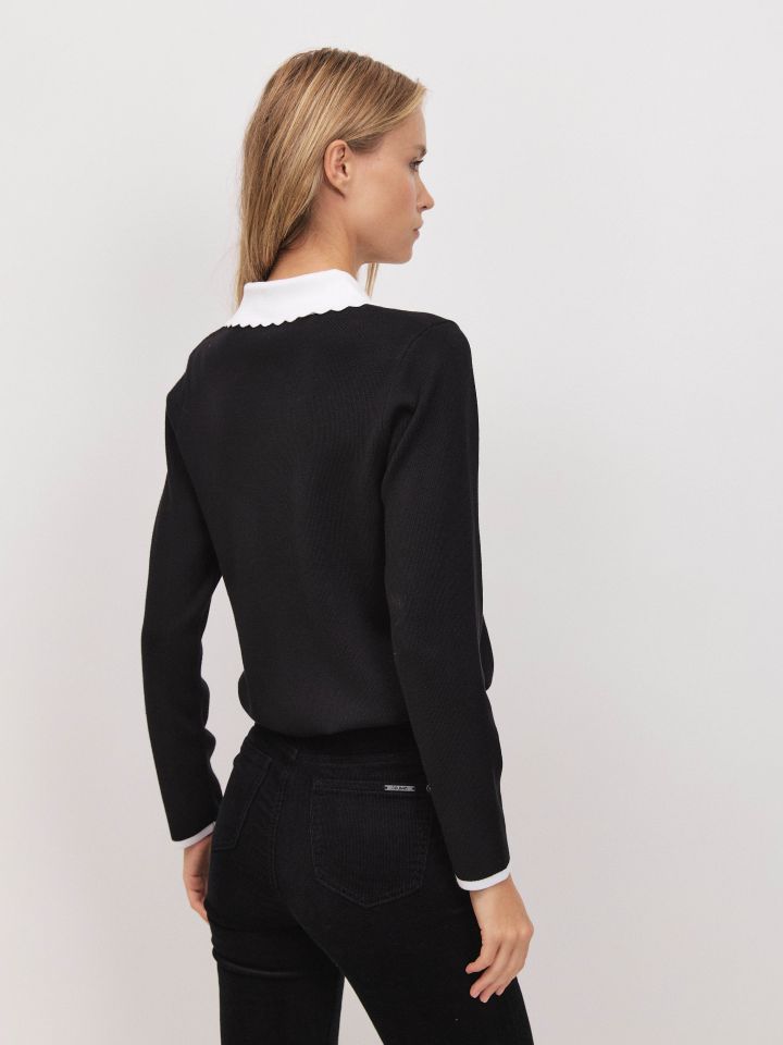 סריג צוארון כיסים שילובים בצבע שחור