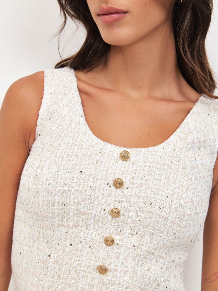 וסט לורקס כפתורים בצבע אופוויט