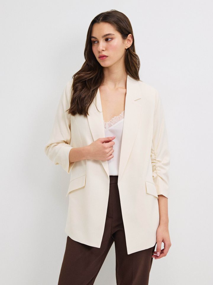 ג’קט כיווץ בשרוול PROMO בצבע בייז’