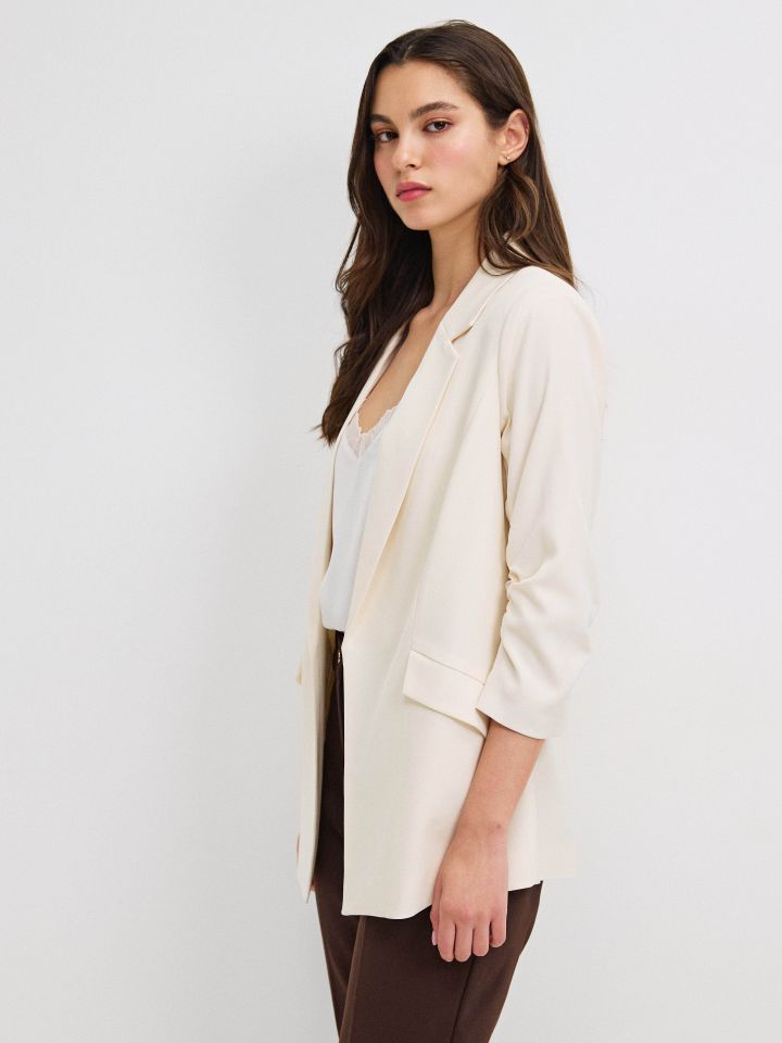 ג’קט כיווץ בשרוול PROMO בצבע בייז’