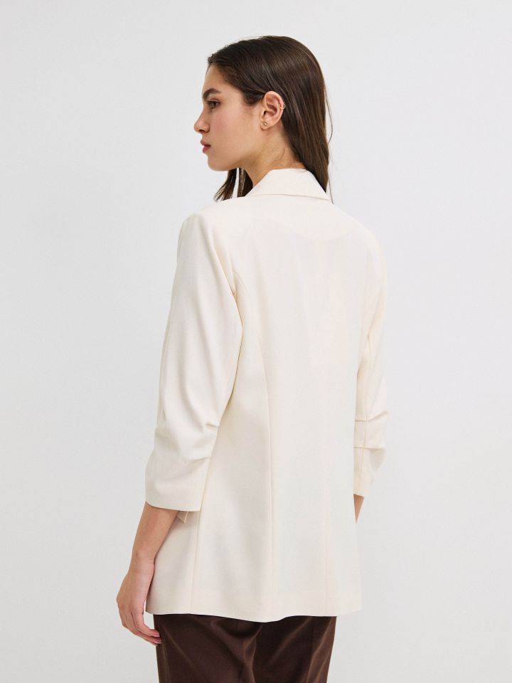 ג’קט כיווץ בשרוול PROMO בצבע בייז’