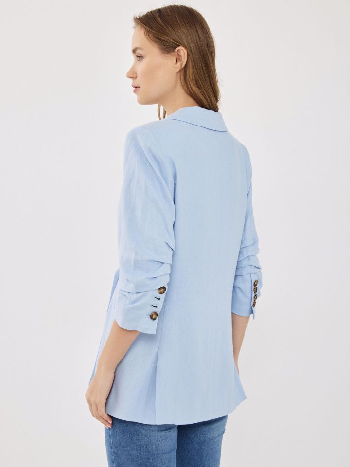 ג’קט  כיווץ בשרוול בצבע תכלת אוקינוס