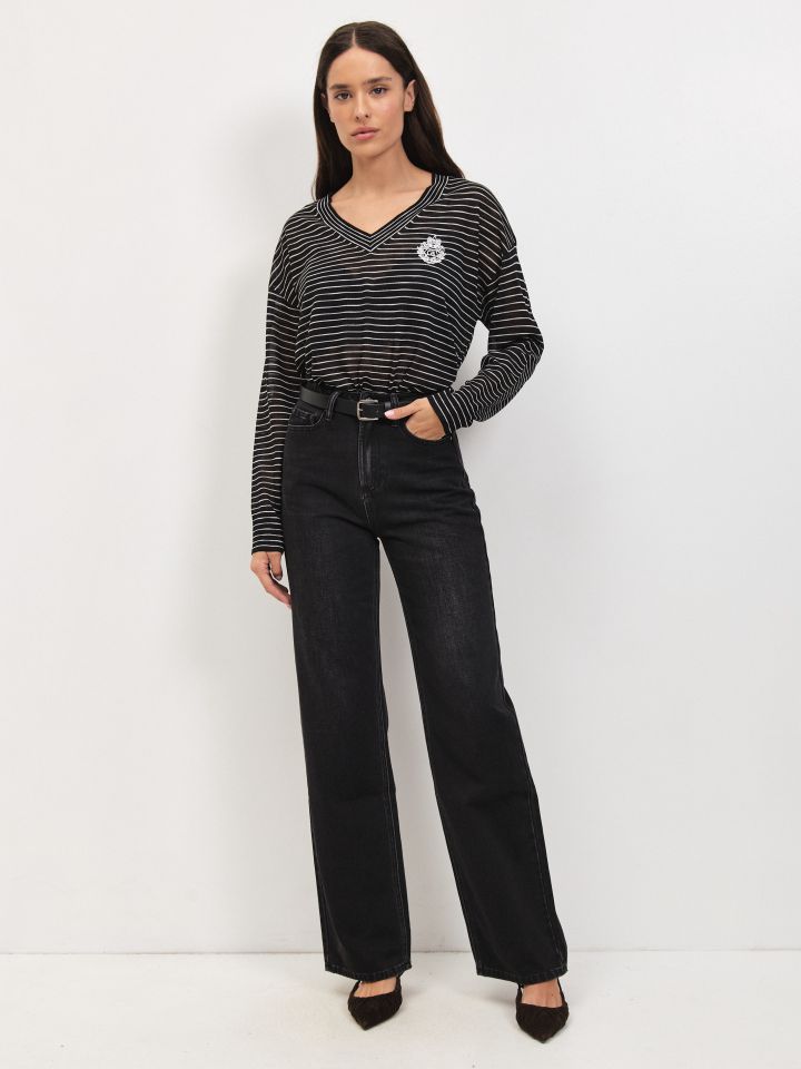 מכנסיים גינס שחור מתרחב בצבע ג’ינס שחור