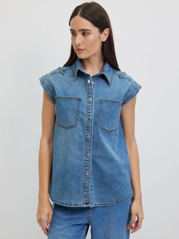 וסט ג’ינס כיסים בצבע ג’ינס